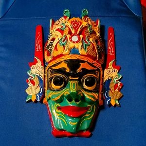 Hand carved wood mask from The Great Wall in China. A great conversational piece